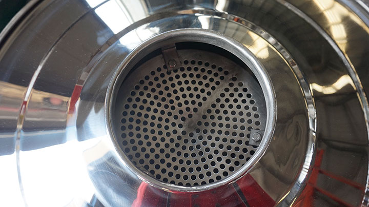 Top view of mirror polished stainless steel vibrating screen inlet and perforated mesh for food powder processing